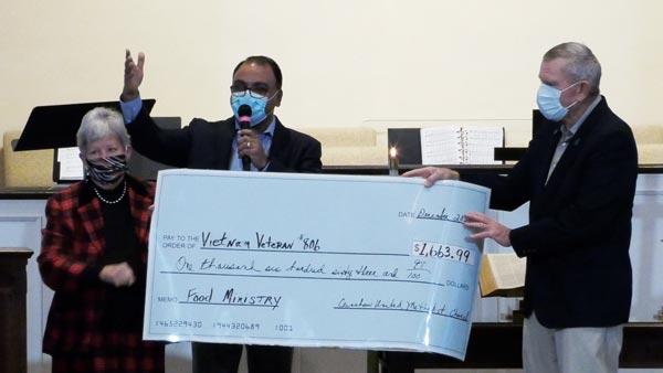 CUMC presents Vietnam Veterans #806 with a check for $1663.99 for their food ministry.
